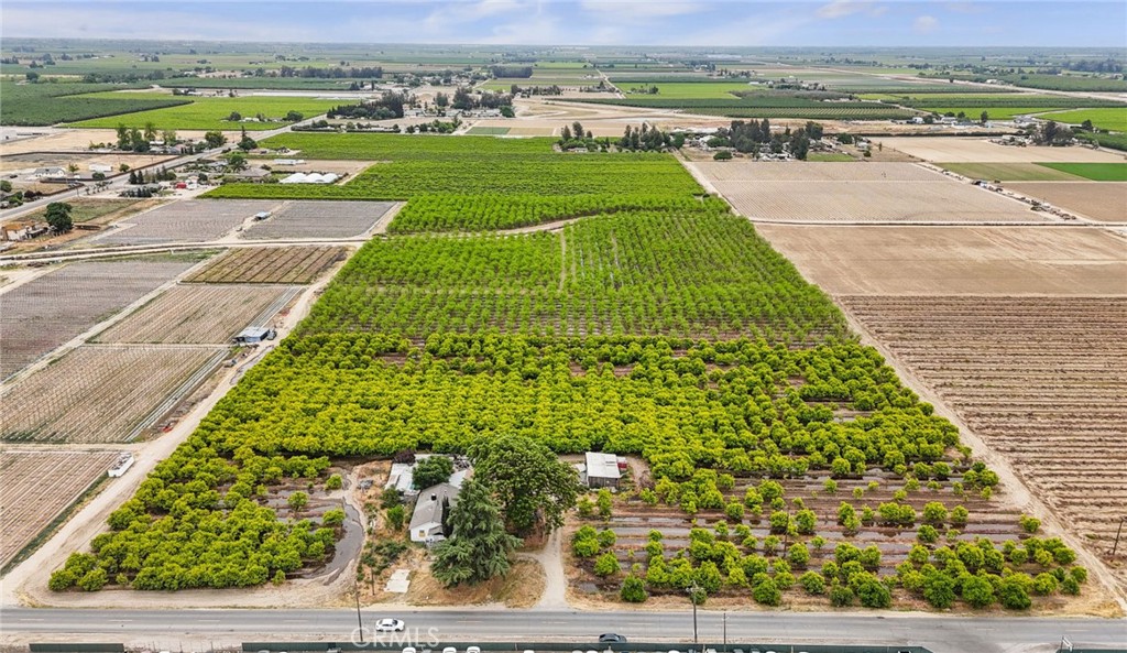 19.55 acres planted with producing persimmon and jujube trees.

Property includes an approximately 2,228 sq ft home in need of repair.

Located in Fresno County and surrounded by heavy and light industrial zoned properties.

Potential development opportunity due to location and surrounding uses.

Buyer to verify all information including zoning, development potential, and property condition.