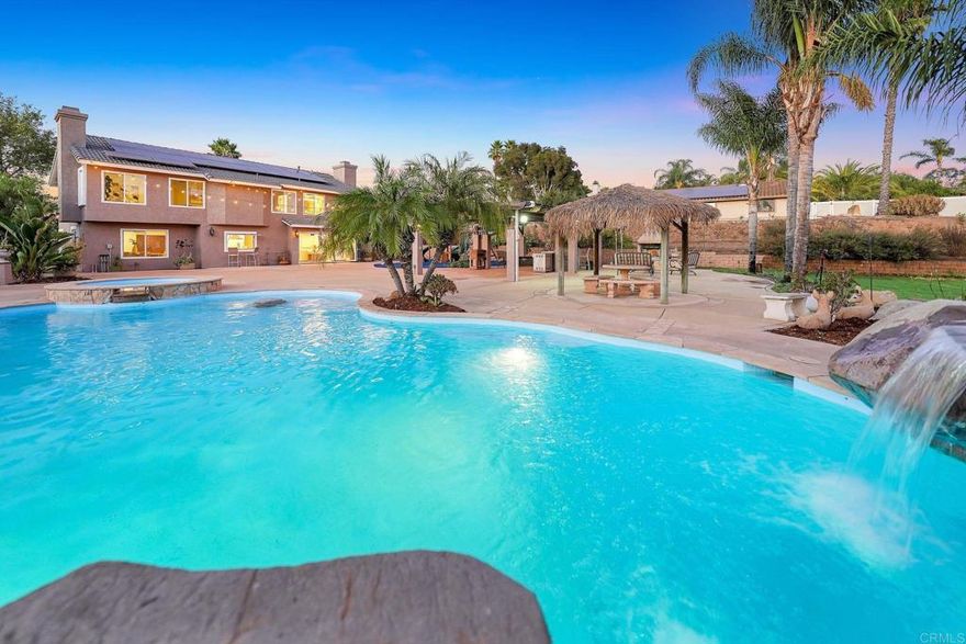 You are going to love this house! The heart of Jamul brings to you this gem of a property, conveniently located close to schools, parks, restaurants and shopping. This gorgeous and recently remodeled home features 3 Master Rooms, 2 laundry stations, a grand and luxurious kitchen with Taj Mahal quartz countertops with brand-new Cafe appliances. It also has paid solar panels, new floors, new bathrooms, new windows, new garage doors, a powerful AC unit, a football field with natural sod, a new playground area, a grand pergola, a pool and jacuzzi, and more, much, much more. An open concept allows you to enjoy a bright and fresh ambiance, embellished by luxurious finishes throughout the house. On the second floor you will find 1 enormous master bedroom overlooking the resort like backyard, another master room, 2 more large rooms, and a washer/dryer station. On the first floor you will find another Master bedroom.  A large driveway leads to a 3-car garage. This 1.34-acre property has all the space you need to park your RV’s, boats, build another house, a horse stable, you name it. You want this property? let’s make it happen, let’s make it yours now!