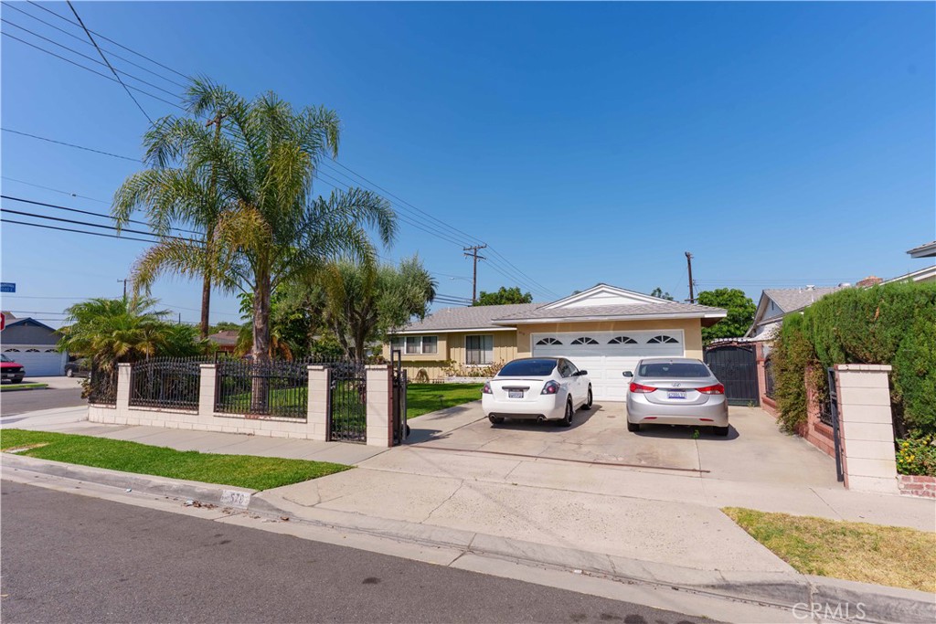 This nice Anaheim corner home features tastefully remodeled bathrooms, lots of linen storage closets in the hallway, and a large backyard with several fruit trees. A large avocado tree provides great shade, perfect for enjoying a barbecue or simply relaxing. There is also an orange tree, a lime tree, and another avocado tree. The spacious driveway accommodates two cars easily. It is conveniently located near shopping centers and the freeways 91 and 57. There is a large enclosed patio on the back, which could be used as a utility room or game room. With some elbow grease work you may turn this home in need of some TLC, into a great home for you.