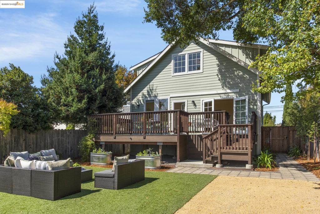 Spacious and beautifully rebuilt, this 5-bedroom, 3.5-bath home combines a modern lay-out with eco-friendly living right in the heart of Central Berkeley. Step inside to a formal entry with plenty of storage—hang your coats, kick off your shoes, and keep it all neat. The gourmet kitchen with island opens to the living and dining areas with custom built-ins, plus there’s a great walk-in pantry and a cool half bath. Also on the main level is a full bedroom with ensuite bath—perfect for guests—and a family room that flows out to a big deck and an amazing backyard with eco turf, sandbox, fruit trees, and gorgeous landscaping. Upstairs you’ll find three bedrooms, all on the same level, plus a laundry room. The primary suite has a large walk-in closet and its own office or sitting nook, while two more bedrooms share a beautifully designed bath. The remodel by the current owners went way beyond cosmetic—think heat pump, updated foundation, plumbing, electrical, new roof, and tankless water heater. Set back with just a couple entry steps, the layout is super flexible and lives easy. All in a prime Central Berkeley spot close to shops, parks, schools, and BART.