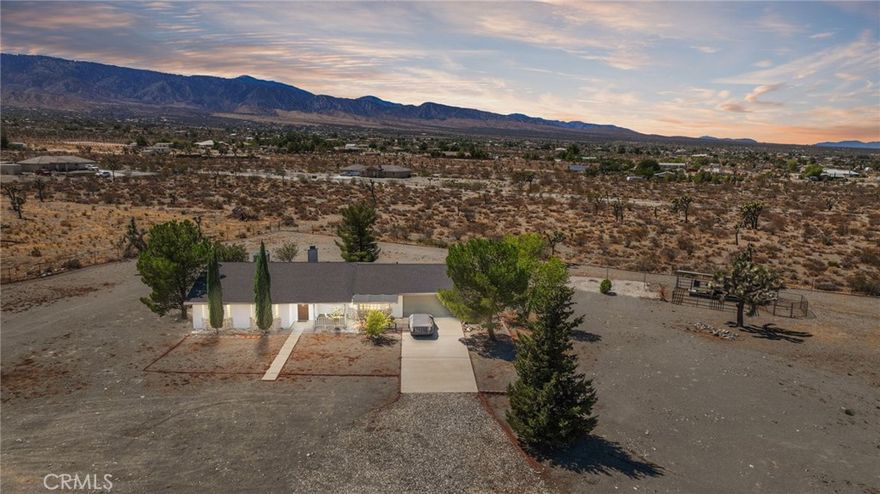 Welcome to your desert retreat at 11574 Silverrock Road — a charming 3-bedroom, 2-bathroom home situated on a sprawling 2-acre fully fenced lot in the peaceful and scenic community of Pinon Hills. With over 1,600 sq ft of living space, this well-kept property offers comfort, functionality, and endless potential for those seeking space and serenity.



Step inside to an inviting layout perfect for daily living or weekend getaways. The home has been recently upgraded with a new roof and a brand-new A/C system, ensuring year-round comfort and energy efficiency. A spacious 2-car attached garage provides secure parking and additional storage options.



Outside, the land is ready for your rural lifestyle. Whether you're into horses, gardening, or wide-open skies, you’ll love the fully operational horse stable and the ample room for animals, vehicles, or future expansion. The property also features a leach line system to assist with efficient water drainage, supporting both septic health and proper land use.