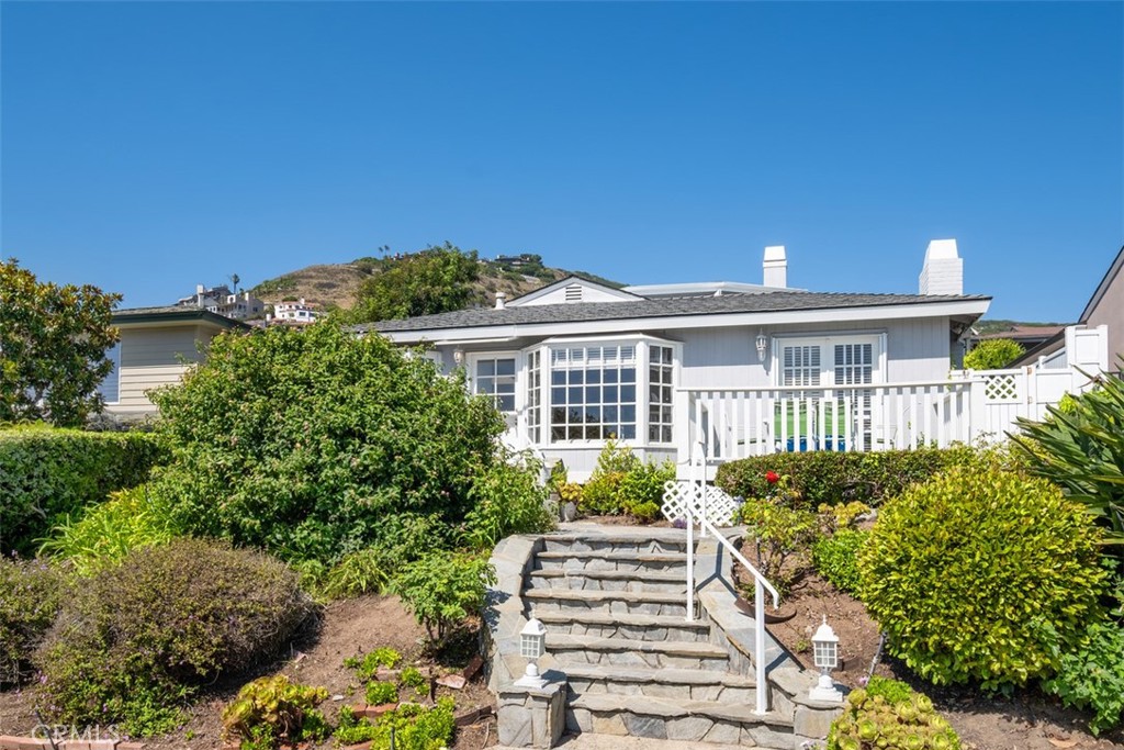 Welcome home to this charming, ocean view cottage in guard gated Lower Three Arch Bay. Just a few minute stroll to private access Three Arch Bay beach, known for the arches that give this exceptional community it's name. This SHORT TERM rental (not available July and August) home comes furnished with 2 bedrooms/2 baths on the main floor and an upper floor primary bedroom with a fireplace and an ocean view deck. On the main floor enjoy dining outside on the patio. Three Arch Bay is one of the premier, private neighborhoods along the west coast. Three Arch Bay hosts many unique neighborhood events throughout the year: park nights, Halloween parade, Santa in the park, the annual Christmas Tree Lighting and the Easter Egg hunt to name a few. The clubhouse and park include tennis (additional fee), basketball court, tot lot and park. Home comes complete with a golf cart for easy access around the community. In addition, parking is gated. This a non smoking and ABSOLUTELY NO pets residence.
