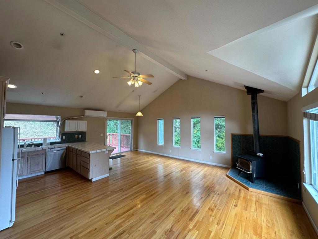 Spacious 3 bedroom, 2.5 bathroom single family home in the Redwood Lodge neighborhood of the Santa Cruz mountains. Located approximately 2± miles from the Summit Store, 9.5± miles to Soquel, and 14± miles to Los Gatos! Nearby local wineries include Silver Mountain, Burrell School Vineyard, Regale Vineyard, and Wrights Station Vineyard and Winery. This home features a reverse floor plan, with 2 bedrooms, 1 full bathroom, laundry area, and the attached 2 car garage on the ground floor. Kitchen/great room, powder room, and primary suite on the upper floor. Situated on nearly an acre of land with the convenience of a mutual water company servicing a limited number of homes. Other features include central heat, mini split air conditioning located in the great room, whole house fan, gas range, new fridge, high ceilings, wood burning stove, attached 2 car garage with plenty of storage space, and more. Los Gatos Schools.