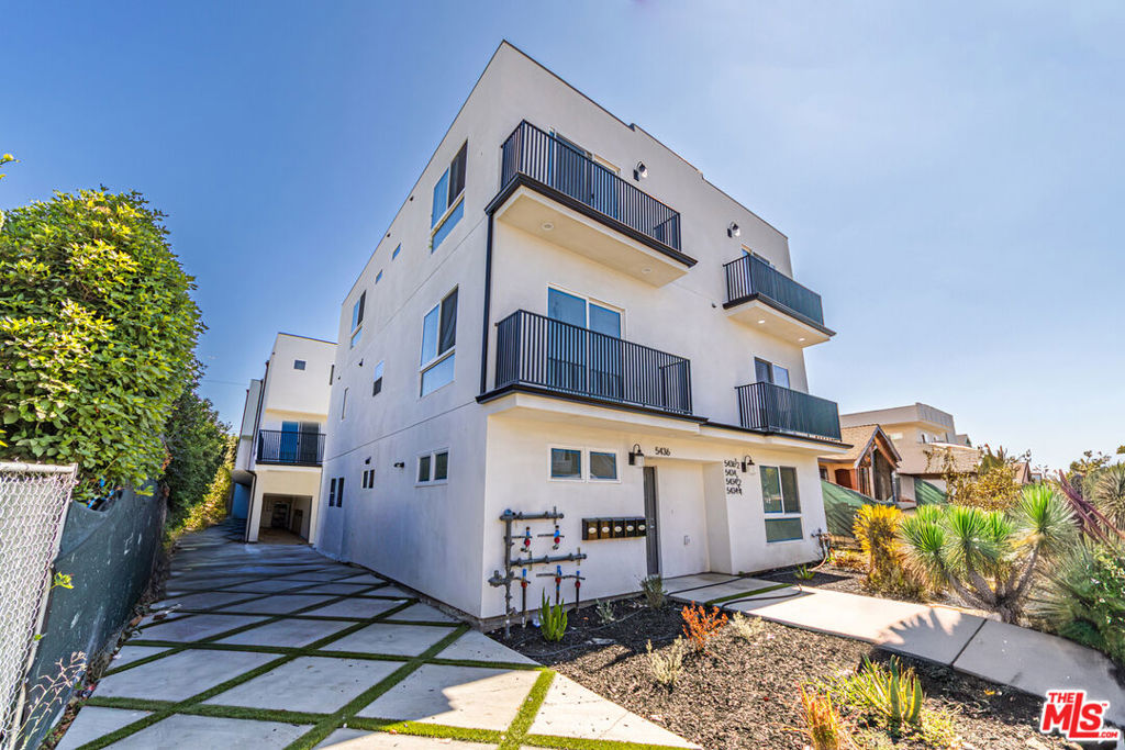 Welcome to 5436 Romaine- A Modern Massive Brand New 2025 Construction non rent control 5-unit building that is located in an Qualified Opportunity Zone area which offers significant tax benefits (buyers can consult with their CPA for all the benefits). This huge sleek 5-Plex features 9,437 sq ft of livable area, an unheard of projected cap rate of 6.84% in Hollywood and an unmatched price per sq ft of $423 in Hollywood well below replacement costs. This luxury complex is comprised of two duplexes, (2) with an attached ADU on one of the duplexes, featuring (4) four beds, four baths and (1) Five bed, Five bath- ranging from approx 1800 sq ft-2100 sq ft with big bedrooms throughout. 5436 Romaine is located minutes from Larchmont, Los Feliz, Silverlake, and Melrose, it's very central location becoming very attractive for renters. Each unit has beautiful oak color vinyl flooring with a ton of natural light and additional recessed lights in all units. All units have brand new stainless steel appliances, washer, dryer and designer lovely grey kitchen cabinets with white calcatta quartz countertops, designer bathroom tiles, enormous balconies and patios, and Central A/C & Heating. The units consists of 10 total parking spaces, including covered garages and carport spaces. Each unit is separately metered for utilities. Buyer will enjoy a 1 year building warranty, low maintenance and very low expenses. Some of the units have beautiful views of the Griffith observatory, Hollywood sign and Hollywood Hills. Recent nearby 4plex building sold for $3,685,000 making this building priced very well and rare to find! Buyer to verify all!