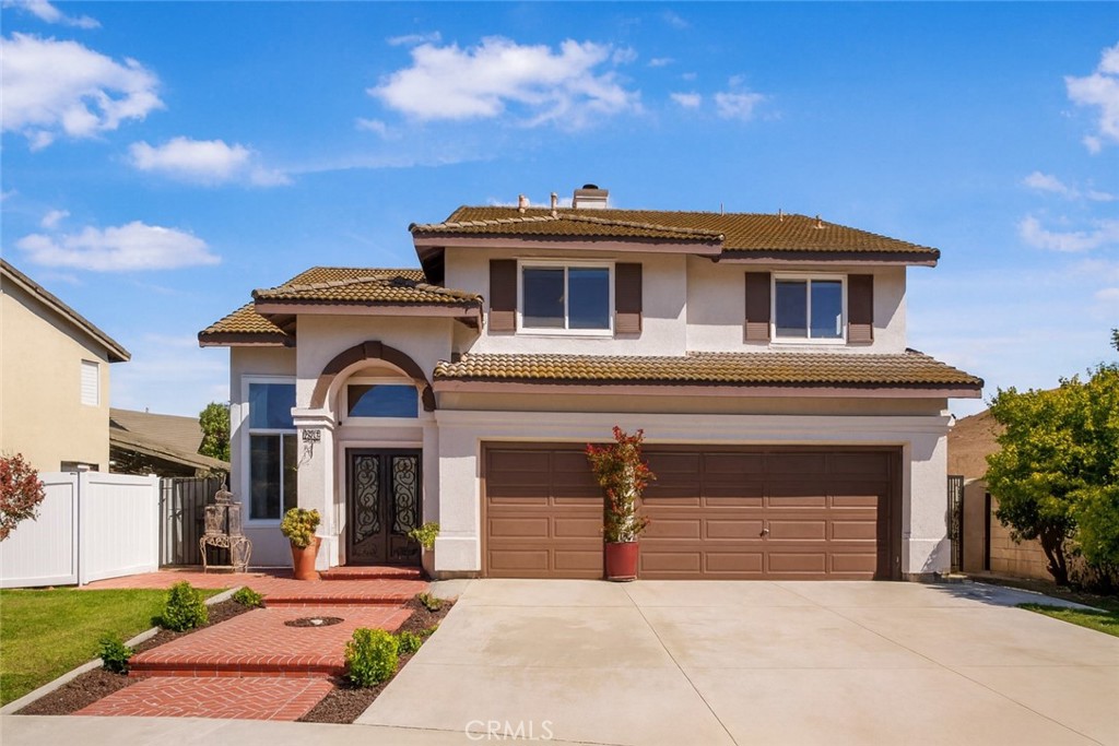 Nestled on a quiet cul-de-sac in the heart of Chino Hills, this beautifully updated home offers the perfect blend of comfort, style, and entertaining space. Featuring 4 bedrooms and 3 full bathrooms — including a downstairs full bath and a potential 5th bedroom — the flexible layout is ideal for families or multi-generational living. Step through elegant iron double doors into soaring cathedral ceilings and a formal living and dining room that make a dramatic first impression. The upgraded kitchen is a chef’s dream, featuring custom cabinetry, quartzite countertops, a GE Café gourmet stove and oven, and two wine/beverage fridges. It flows seamlessly into an oversized family room with a cozy fireplace and wet bar, creating the perfect setting for gatherings.
Upstairs, the expansive primary suite feels like a private retreat, complete with dual closets and a remodeled spa-inspired bathroom showcasing quartzite counters and a large walk-in shower. Additional highlights include engineered wood flooring, dual-pane windows, mirrored closet doors, built-ins, dual A/C units, and a 3-car garage.
The backyard is designed for entertaining, with pavers throughout, a built-in bar, gazebo, and spa — a true outdoor oasis. Homes like this in Chino Hills are rare and highly sought after. Don’t miss your chance to make it yours — schedule your private tour today!