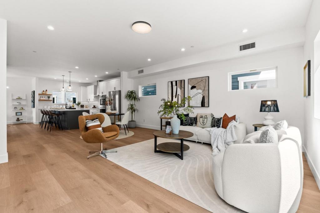 Step into luxury and convenience in this new, 4-bedroom home in Mountain View. Just completed in 2024, this multi-level residence offers 1,850 sf of living space tailored to the needs of a contemporary lifestyle. Enjoy a ground-level guest suite, the main level with open living space and a chef's kitchen, a private balcony for al fresco enjoyment, and the expansive, upstairs primary suite. This stunning open-concept floor plan boasts West Elm lighting & high-end finishes throughout. The epitome of luxury living, from beautiful Flooring, Pantry, Shaker cabinets, Double ovens, LaCava & Kohler bathroom sinks, Toto toilets, dual-zone HVAC, Washer & Dryer. Window covering is included, as well as a private front porch, private balcony, and amazing low-maintenance landscape managed by the HOA. Attached, 2-car garage with a pre-installed EV charger, plumbed for solar. This location puts everything the area has to offer within easy reach - downtown Mountain View, Los Altos, and The Village at San Antonio Center are short drives away, and major tech campuses, including Google, Microsoft, ARM, Intuit, NVIDIA, Samsung, Apple, & Meta, are close at hand. A charming park is just down the street. Featuring award-winning MV/Los Altos Schools (top-rated Los Altos High School).