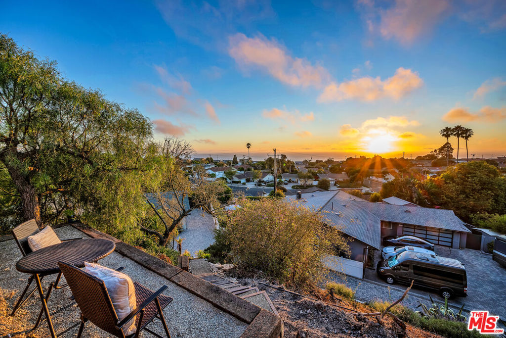 Enjoy Panoramic Ocean / City Views and Resort-Style Living in Rancho Palos Verdes! Welcome to one of the most exceptional homes in the exclusive Los Verdes neighborhood of Rancho Palos Verdes. Nestled at the end of a quiet cul-de-sac, this expansive 5 -bedroom, 3 - bathroom residence offers over 2,500 square feet of elegant living space on a rare 34,323 sq ft lot - the second largest in all of Los Verdes. From the moment you arrive, you're greeted by lush landscaping enhanced with a variety of fruit trees, creating a serene and private retreat. Step inside to discover an open - concept layout designed for both comfort and sophistication. The spacious living room with a cozy fireplace flows seamlessly into the formal dining area, both opening to an entertainer's dream backyard complete with a sparkling pool, manicured grounds, and resort-style ambiance. The heart of the home is the large open kitchen, featuring a center island perfect for gathering, cooking, and creating memories. Two luxurious primary suites are ideal for multi -generational living or hosting guests offering spa - like bathrooms and generous closet space. A stunning hillside deck provides breathtaking panoramic ocean and city views, making it the perfect spot for morning coffee or sunset cocktails. Other features include operable skylights, recessed lighting, 2 car garage, inside laundry room and a long driveway with RV parking capacity. Whether you're relaxing indoors or enjoying the expansive outdoor spaces, this home delivers the ultimate Southern California lifestyle. Located minutes from top-rated schools, scenic hiking trails, and coastal attractions, this rare gem combines tranquility, luxury and convenience in one extraordinary package. Schedule your private tour today and experience the unmatched charm of Los Verdes living.
