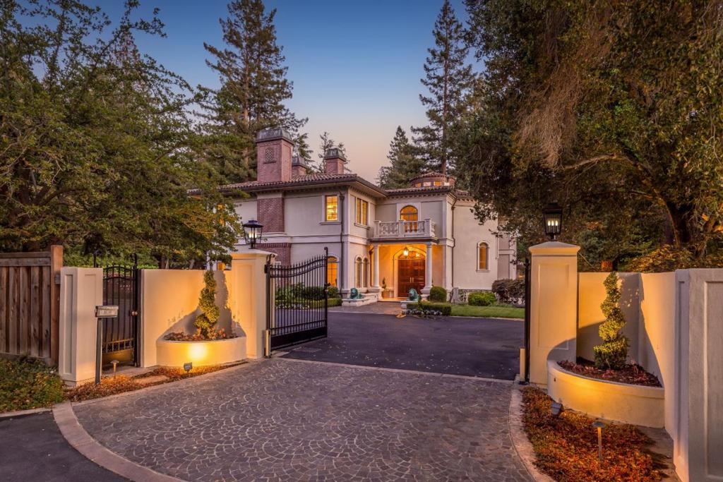 European Grandeur within Two Blocks of the Menlo Circus Club! Set behind a gated entrance on beautifully landscaped grounds of more than one acre, this magnificent residence portrays timeless grandeur in the most prestigious area of Atherton. Built in 2001 by Lencioni Construction, this home is masterfully crafted inside and out with the highest level of quality and attention to detail.Comprising more than 12,000 total sq ft, the main residence is 3 stories, serviced by an elevator. An elegant living room, library and dining room look onto the vast terraces and grounds. A chef's kitchen with informal dining is light-filled. Additional gathering areas include a large family room and rec room. There are 7 spacious bedrooms, the primary suite and 4 bedrooms are located on the upper level. A guest suite with kitchenette and private entrance is perfect for an au pair. Car enthusiasts, an underground garage has parking for up to 5 cars as well as a detached 2-car garage. OPEN SUN BY APPT