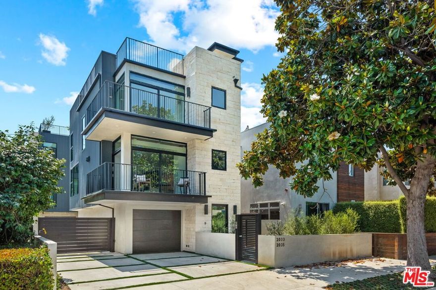 Welcome to this stunning architectural gem in prime West Los Angeles, nestled on a picturesque tree-lined street in the Sawtelle District.  Designed by renowned architect Bill Bernstein, this 3-bedroom, 3.5-bathroom home redefines luxury living with impeccable attention to detail. Gated for privacy, the home offers a 2-car garage with direct access to the ground floor. Upon entering, you're greeted by a gracious entry and sitting area, setting the tone for the elegance that awaits. The ground floor features a flexible bedroom suite, perfect for a guest room or home office. On the second floor, you'll find a seamless open-concept layout. The great room encompasses a gourmet kitchen with an oversized center island / eating bar, a stylish dining area, and a living room with fireplace. Expansive Fleetwood sliding glass doors open onto a wraparound balcony, offering an indoor-outdoor flow for entertaining or relaxing, and the prefect blend of luxury and comfort. The upper level features an elegant primary suite with a spa-like bathroom, including a separate tub and steam shower for ultimate relaxation. Adjacent to the primary suite is a street facing corner bedroom with its own private balcony with city views, providing a serene retreat. The rooftop deck, equipped with an outdoor kitchen and breathtaking 360-degree city and mountain views, is perfect for al fresco dining, weekend barbecues or just lounging in the sun.  Additional amenities include a convenient second floor laundry room, multi-zone HVAC, an alarm system, and a wine refrigerator, enhancing both functionality and luxury. Ideally located near the vibrant shops and acclaimed restaurants of Sawtelle and Century City, this home is also just a short drive from UCLA and other sought-after Westside neighborhoods. This is a rare opportunity to live in a virtually new residence of unparalleled design.
