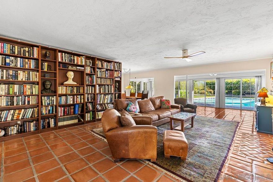 Tremendous value in North Poway - stunning home located on close to half an acre in the heart of highly sought after Green Valley! Fully owned 12.47 KW solar with two full house backup batteries. New owner is grandfathered in to SDGE NEM 2.0. With over $300K in upgrades and nearly 900 feet of extra living space for a total of 3,600 square feet, this ranch-style home is perfect for extended families, and features five bedrooms and three full bathrooms. Authentic Saltillo tile floors and a spacious enclosed sunroom offer views of the private pool area. The inviting patio with new pavers and a retractable awning leads to a large pool that has been completely renovated; the new pool equipment, huge amount of pool solar and gas heater, Fastlane swim system, and large hot tub make it a water lover’s paradise. This single level home is built to enjoy the beautiful Poway weather, with most rooms having their own exterior door to the outside. There is a complete second kitchen in the newer addition at the back, perfect for large families. A private separate structure houses a large, comfortable office, which could easily be converted into a lucrative ADU by adding a bathroom in the adjoining sunroom. There are very productive orange, tangerine and lemon trees in the back yard, and recently widened driveway provides ample room for parking. A new HVAC system and a new main electrical panel complete this very unique and desirable home!
