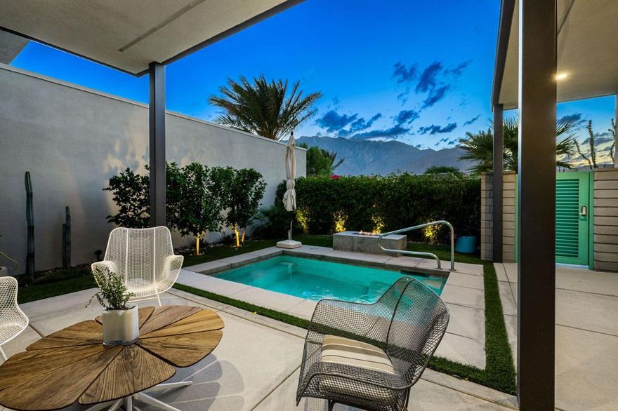 With breathtaking views of the San Jacinto Mountains to the west and stunning views of an Olive Tree grove to the east, this stunning Miralon home offers thoughtful and sophisticated design features with all the modern luxuries including premium appliances, owned solar, and extensive builder upgrades for improved design and function (see upgrades list attached). Set on Fee Land (meaning you own the land-no land lease), this single-story home offers 2,100 SF, made up of 2-bedrooms, a den (that can easily be converted back to a bedroom), and 2-1/2 bathrooms, all in an open-plan design with exceptional finishes including a custom fireplace, designer lighting, and curated draperies and wallcoverings that create a seamless design aesthetic throughout. The property's design is true modern luxury with finishes including porcelain tile floors throughout the living areas, elevated KitchenAid appliances including a warming drawer, 20 owned and fully paid for solar panels with an output of 9.640 KWH, and an Oceanus full-house water softener.  Interior walls are insulated, and the spacious garage is climate controlled.  The flawlessly designed and meticulously maintained outdoor space includes a spa/ pool, fire pit and multiple entertaining areas with spectacular views. As a resident of Miralon, you will enjoy resort living with gated access, open spaces with 360 valley views, and a residents-only club with two beautiful pools, fitness center, Chef's demo kitchen and grills, Bocci court, the MiraBar and Coffee Hub.  If you are seeking a truly Architectural Digest level modern home, you are invited to schedule a private viewing today!