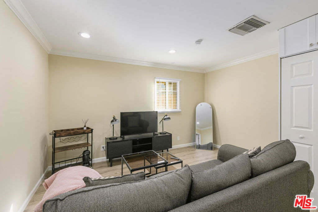 Welcome to this bright, recently refreshed, move-in ready unit that checks all the boxes. Enjoy a comfortable living room with recessed lighting, two well-proportioned bedrooms, and an eat-in kitchen with ample cabinetry and a full appliance package (range/oven, microwave, refrigerator, dishwasher). Enjoy the comfort of in-unit washer & dryer. Additional features include durable plank flooring and dual-pane windows. Step outside to a shared courtyard perfect for morning coffee and a sparkling community pool for sunny LA days. All in a convenient North Hollywood location near the NoHo Arts District, dining, parks, and transit, with easy neighborhood street parking.