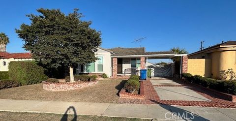 Photo of 10038 S St Andrews Pl, Los Angeles, CA 90047 (MLS # IN25252375)