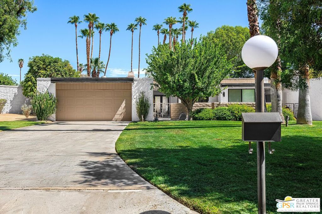 Welcome to Mesquite Canyon Estates, a rare opportunity to own a piece of Palm Springs design history. Originally created by renowned architect William Krisel, this home was part of the final project by noted builder Roy Fey. Set in a private community of just 40 residences on 17 beautifully landscaped acres, the location offers privacy, mountain views, and resort-style amenities, all on fee land (you own the land). Bordering the new 120-acre Prescot Preserve and adjacent to the upcoming CV Link trail, this home blends natural surroundings with modernist design. Inside, the 2BD/3BA + den layout features 12' ceilings, clerestory windows, and walls of glass that fill the space with light and connect seamlessly to the outdoors. The expanded, fully renovated chef's kitchen includes sleek Italian black walnut laminate cabinetry, black quartz countertops, creating a clean, functional space for cooking and entertaining. The den with fireplace makes an ideal media room, office, or optional third bedroom. The primary suite includes a spacious walk-in closet and a luxurious bath with a Bustillos shower system and modern finishes. Two private patios, front and rear, extend the living space for year-round indoor-outdoor enjoyment. Luxury meets performance with updated HVAC systems (August 2025) and a sleek, high-end tankless water heater. Current owners performed the complete renovation with attention to detail and an eye for design. Community amenities include three pools and spas, two tennis/pickleball courts, and lush greenbelts throughout. The HOA is pursuing historic designation, with potential Mills Act tax savings for owners. Featured on the 2024 Modernism Week Tour, this home represents the best of Palm Springs mid-century designpreserved, updated, and perfectly situated.