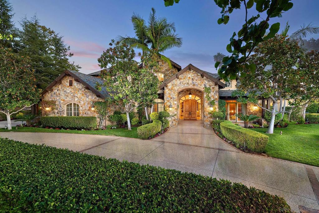 An Iconic French Country Estate in The Heritage Set within the gate-guarded, exclusive community of The Heritage, this Greg Agee French Country masterpiece claims a premier position on over an acre along the second hole of the world-class Maderas Golf Club. Spanning more than 7,800 square feet, this estate blends timeless architectural integrity with resort-inspired living, all framed by immersive panoramic views. A dramatic entry crowned with a dazzling chandelier welcomes you into interiors of refined sophistication—soaring ceilings, freshly refinished hardwood floors, custom millwork, and wainscoting throughout. The great room commands attention with its grand masonry fireplace, vaulted wood-beamed ceilings, and seamless flow into the heart of the home. The gourmet kitchen is a chef’s statement, boasting dual Sub-Zeros, a Viking 6-burner range with flat grill, dual Bosch dishwashers, custom alder cabinetry, and a sunlit dining area with golf course views. Formal and casual spaces—from the elegant dining room to the inviting bar—set the stage for effortless entertaining. Designed to live primarily as a single level, the residence offers a serene ground-floor primary suite with dual walk-in closets, dual water closets, and spa-inspired vanities. A handsome office, an additional ensuite bedroom on the main level, with three upper ensuite retreats ensure comfort for all. A detached one-bedroom casita adds privacy and resort style living for extended guests. Outdoors, the home transforms into a private resort: a vanishing-edge pool spilling toward the fairways. Set on a highly desirable street within the Heritage. Outdoors, the home transforms into a private resort: a vanishing-edge pool spilling toward the fairways, a dramatic waterfall spa, and a fully equipped outdoor kitchen and dining pavilion—all capturing the breathtaking backdrop of Maderas’ rolling fairways. A detailed authentic custom slate roof, motor court with 4 car garage. This estate is more than a residence; it is a legacy of artistry, elegance, and exclusivity—standing proudly among the most distinguished properties within The Heritage.