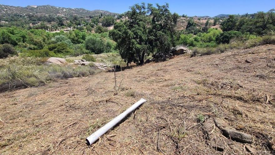 WOW! Whole new look and come see for yourself! 4.29 ACRES WITH FOREVER VIEWS of the pastoral valley and surrounding mountains. NO HOA, NO DUES and NO CC+R'S! This is an exceptional parcel featuring a paved access that ends in a private cul-de-sac shared with only 3 other quality homes. The terrain is varied with sloping to steep in areas and enhanced by an inviting seasonal creek with mature Oaks, unique outcroppings and natural habitat. This is a rare find for the property features an access road which meets Fire Code, electric and water utilities available to site and septic layout for potential home. Note attached Property summary, grading plan with septic layout.