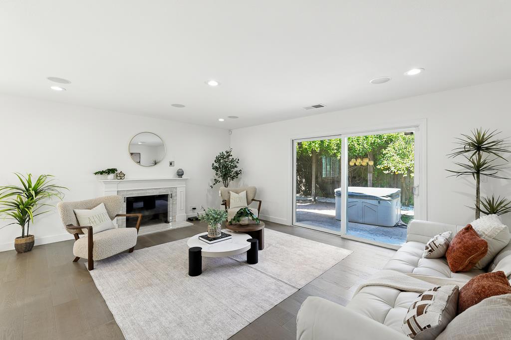 Welcome to this beautifully upgraded 4-bedroom, 2-bathroom home in the heart of Santa Clara, blending comfort, style, and functionality. The spacious living room overlooks the backyard with abundant natural light, while recessed lighting and skylight brighten the inviting interior. The updated kitchen boasts an electric range, sleek new countertops, premium cabinets, and a stunning skylight, seamlessly connected to the family room. Bathrooms feature mirrored cabinets, new light fixtures, and customized vanities. Additional highlights include central AC, a whole-house fan, cozy fireplace, dedicated laundry area, and a 2-car garage. Thoughtful upgrades include new flooring, cabinetry, appliances, water systems, irrigation, electrical panel, and garage restoration (buyer to verify). The backyard is beautifully landscaped with prolific fruit trees and generous space for entertaining or potential addition. A long driveway offers excellent potential for RV or boat parking. Ideally located near Apple Park, Nvidia, Intel, Google, ServiceNow, and Applied Materials, with easy access to Santana Row, Valley Fair, Central Park, Henry Schmidt Park, and Santa Clara University. Close to top private schools including Saint Clare, St. Justin, Stratford, The Harker, and Archbishop Mitty.