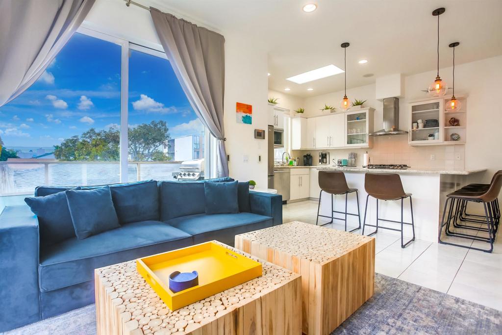 Rare South Mission where beachside living meets modern style in this rare 3/3 w/ en suites. High ceiling w/ a wrap around balcony off great room, 1 balcony off master and large, front private patio. This exceptional boutique 4-unit complex, is just steps away from the pristine sands and perfectly located on beautiful court w/ the perfect combination of beach lifestyle & indoor-outdoor living. This prime SW corner is flooded with light, high ceilings w/skylight, spacious open kitchen & great room just perfect for entertaining. Large front private patio, large 2 car garage & in unit washer/dryer. A tranquil retreat overlooking overlooking lush landscaping. *Seller say, " BRING ALL OFFERS" wants this sold.*Great for investors / 1031 exchange / Second Home *CONT'D* The wraparound deck and private gated patio provide perfect spaces for relaxing or entertaining. The modern kitchen boasts granite countertops and stainless steel appliances including new refrigerator, new dryer and new dishwasher, while each of the three bedrooms offers privacy and comfort with new carpets. The upstairs primary suite includes its own south-facing deck and a skylit en-suite bath. A second upstairs bedroom also features an en-suite, and the ground-level bedroom opens to a private patio through sliding glass doors. Additional highlights include a 2-car garage with new opener, new tankless water heater and the unbeatable lifestyle of South Mission Beach, where wider lots and lower density create a more livable, open atmosphere. Exceptionally well-priced to sell—don’t miss your chance to own this beachside gem!