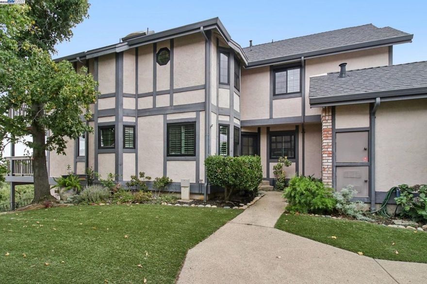 Stunning, move-in ready end-unit in Lafayette’s desirable Haslemere community with breathtaking views of the Carquinez Strait, hillsides, and valley from both decks. This extensively updated 3BD/3BA unit lives like a single-family home with only one shared wall and an attached 2-car garage. The dramatic main level features soaring ceilings, engineered hardwood floors (Heirloom Collection by Provenza), updated windows, and fresh interior paint.  It includes a spacious living room with fireplace, dining area, full bath, and a versatile bedroom or home office with custom French doors. The eat-in kitchen boasts a Samsung convection double oven and designer touches throughout. Upstairs, the serene primary suite offers vaulted ceilings, a private deck with views, spa-like bath, and blackout window treatments. A second spacious ensuite bedroom and laundry area complete the upper level. Additional highlights include USB outlets, plantation shutters, new garage doors, turf lawn, bonus storage, and updated HVAC. Both newly refinished decks provide the perfect setting to unwind while enjoying panoramic views. Community pool, spa, and BBQ area. Minutes to BART, freeways, top-rated Lafayette schools, and shopping. Views:  Ridge