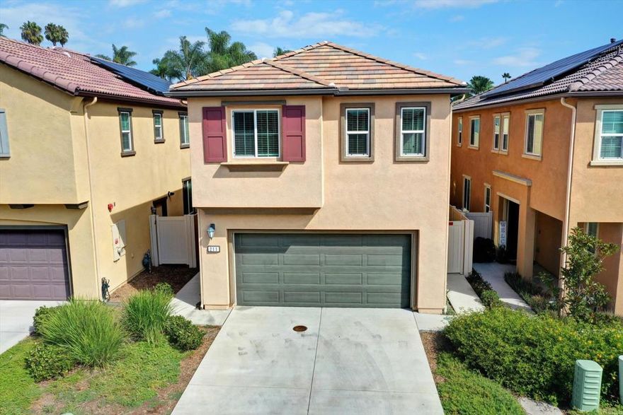 Built in 2020 and still feeling brand new! This modern Laurel Creek home has been freshly updated with brand-new carpet and a full interior paint refresh, making it truly move-in ready.  Step inside to an open and inviting floor plan where the living, dining, and kitchen areas flow seamlessly together. The contemporary kitchen shines with quartz countertops, stainless steel appliances, shaker cabinetry, and a center island that doubles as a casual dining or work-from-home spot.  Upstairs, the spacious primary suite features an oversized walk-in closet and en-suite bath with dual sinks and walk-in shower. Two additional bedrooms are joined by a versatile loft — perfect as a family room, playroom, or office. Energy-efficient upgrades include solar, a tankless water heater, and smart home features to keep life convenient and affordable.  Community amenities include a spa, BBQ area, and neighborhood parks, plus front yard maintenance included. With easy access to Highway 78 and just minutes from Vista’s growing mix of restaurants, coffee shops, breweries, shopping, and entertainment, this home offers the ideal balance of style, comfort, and convenience.  A rare opportunity to own a nearly new home in a thriving community — don’t miss it!