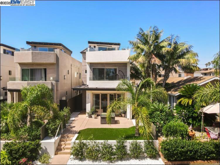 Experience modern coastal living at 1122 Oliver Ave—steps from the bay and just minutes to the beach. This newly built residence features an oversized rooftop lounge with fireplace and panoramic peek views to Mission Bay. The chef-inspired kitchen boasts shaker cabinets, granite counters, stainless steel appliances, and a striking backsplash. Every detail is elevated with curated fixtures, custom tile bathrooms, and flexible living spaces. Complete with a private yard and two-car garage, this home blends luxury design with beachside convenience.
