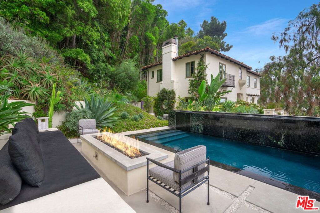 Step into a one of a kind masterpiece completed by AD Hall of Fame Top 100 architect, Daniel Romualdez, with landscapes curated by Sarita Jaccard. This property merges natural beauty with sophisticated urban living. Villa Hillside sits perfectly nestled into the Hollywood Hills but will have you questioning if this is Los Angeles or Tuscany. Moments away from all the top dining and nightlife Los Angeles has to offer. Originally owned by Michael Mann and constructed by Racing Green, Villa Hillside stands as a rare sanctuary where timeless design meets nature, offering a lifestyle of unmatched elegance and tranquility.