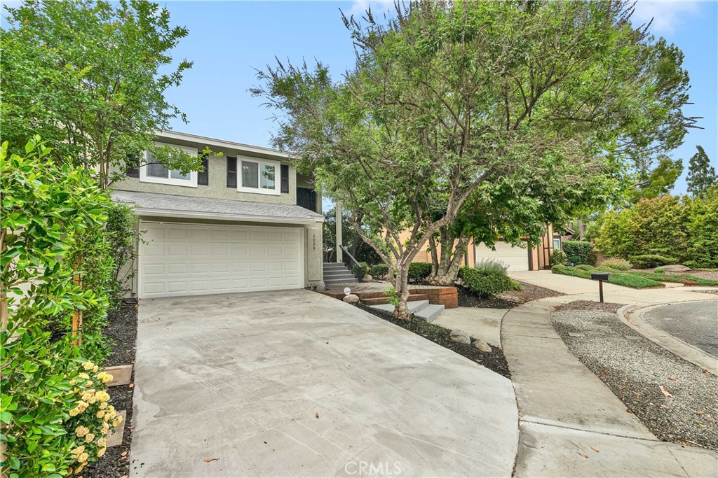 Welcome to this beautifully upgraded 3-bedroom, 2.5-bath home tucked away on a peaceful cul-de-sac in the scenic hills of western Simi Valley. Step through the elegant double doors into a warm, light-filled living room with soaring vaulted ceilings, new flooring, and a cozy fireplace. A large sliding glass door opens to a serene backyard retreat, creating the perfect indoor-outdoor flow. The formal dining area connects seamlessly to the updated kitchen, a true chef’s delight, featuring brand-new white shaker cabinets, sleek quartz countertops, and stainless-steel appliances—ideal for cooking, hosting, or everyday living. Upstairs, the spacious primary suite offers a private balcony with peaceful hillside views. The spa-inspired en-suite bath features dual sinks and a deep soaking tub—your personal escape at the end of a long day. The backyard is an entertainer’s dream, with a charming pergola, mature fruit trees, and a spacious patio—perfect for morning coffee or evening wine. All located near parks, hiking and biking trails, top-rated schools, shopping, dining, and easy freeway access—this home offers comfort, style, and the best of Simi Valley living.