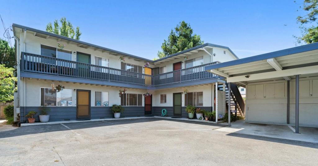 1450 Merrill St, known as Seadowns, is a three-building, nine-unit property that has been owned by the seller for 26 years. It is in close proximity to area beaches, East Cliff Drive, Pleasure Point, the Santa Cruz Small Craft Harbor, Sunday Live Oak farmer's market, Simpkins Swim Center and many local restaurants. The property contains ample outdoor space, providing a peaceful living experience for the renters. The property provides excellent walkability and bikeability. It also has 11 parking spaces, including 5 covered carport spaces. The coin-operated laundry is leased by the owner. The unit mix includes six 1-bedroom, 1-bath units (1-6) in the two-story building. Each of these six units has access to the outdoor space behind the building and has additional locked storage in the carport. Near the front of the property is a 2-bedroom, 1-bath unit (A) with a large fenced front yard, a 1 bedroom, 1-bath unit (B) with a fenced back yard and covered patio, and a stand-alone 2-bedroon, 1-bath unit (C). The owner has completed recent improvements including a new sewer lateral, new roof on the carport and laundry area, and fumigation for termites. Between turnovers, the Landlord has also painted the units, and updated appliances and fixtures, and installed new carpets.