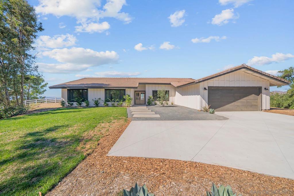 Stunning 4 bed 2.5 bath remodel on expansive 3.9 acre lot perched on a hilltop with panoramic views of wine country! Brand new driveway! Meticulous attention to detail with this Temecula home featuring a bright & open single story floorplan, vaulted ceilings, large family room, abundance of windows, modern fixtures & finishes, chef's kitchen with contrasting white and gray cabinetry, spacious bedrooms and covered patio area off living space. Palatial master retreat featuring spa-like bath with large walk-in, tiled shower. Home features a newly paved driveway, 2 car attached garage and enormous detached garage/workshop. The 3.9 acre lot provides space for potential ADU, pool, vehicles, horse stables, hobbies & toys while offering privacy and quiet. Perfect location for your own peaceful sanctuary!