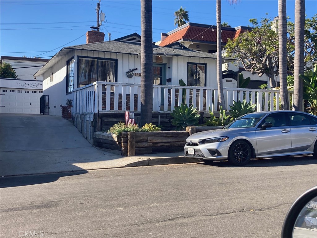 This is a great opportunity to rent a single family home 2 blocks from the beach. Beach access end of the street. Close to beach/pier/shopping/freeway access/restaurants and surfing. Bathroom has been remodeled w/permit. Security system and electronic gate on driveway. Newer appliances & roof. Detached garage and wood floors in both bedrooms. Small RV storage, lots of parking, wood or gas brick fireplace.