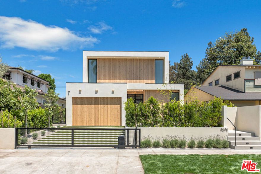 Where design meets intention. This fully custom home north of Ventura Blvd is a rare offering in Studio City's most coveted enclave, just minutes from Erewhon, Equinox, The Shops at Sportsmen's Lodge, and top-rated Carpenter Elementary.Every element of this home was curated with care: plaster walls with molded paint, rustic white oak beams and doors, limestone fireplace, and custom skylights all throughout the home. The chef's kitchen features JennAir, Monogram, and Bosch appliances, all powered by a top-tier electric system designed for ultimate efficiency.The primary suite offers two private balconies and a spa-inspired en-suite with Restoration Hardware vanities. A detached ADU with its own high-end appliances provides endless flexibility. This house is it's a custom, detail-rich retreat designed to feel like a modern resort. A rare combination of thoughtful luxury, timeless materials, and one of LA's best locations.