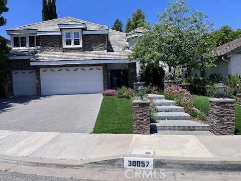 Tucked at the end of a peaceful cul-de-sac, this spacious and upgraded 3,264 sq ft home offers 4 bedrooms, 3 bathrooms, and a large upstairs loft, perfect for a playroom, office, or additional lounge. The main level features one bedroom and full bath, an open-concept kitchen flowing into the family room, and wood-grain tile flooring throughout the downstairs. The expansive primary suite upstairs includes a private sitting area, en-suite bathroom, walk-in closet, and access to a private patio. Enjoy the beautifully landscaped backyard with a sparkling pool, spa, lovely garden and plenty of space to relax or entertain. Additional highlights include a 3-car garage, solar panels with 220 EV charging, upstairs carpeting, and a dedicated laundry room with washer and dryer. Quiet, well-behaved pets are considered (breed restrictions apply). Located within walking distance to Forest Cove Park and close to shops and freeways. Lease includes a gardener, pool, and solar service.