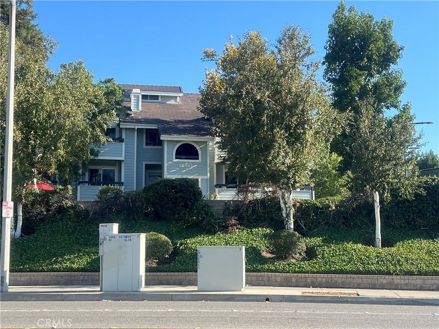 Great opportunity to own this beautiful condominium in Canyon Country! This American Beauty Community unit is located close to shopping, transportation and FWY. Home offers two bedrooms (primary bedroom with walk-in closet), two bathrooms, bright and cozy kitchen with granite counter tops, dining area, living room with fireplace and sliding doors leading to private balcony where you can enjoy the beautiful views! The laminate floors (living room & bedrooms) and tile floors (kitchen & bathrooms) are very nicely kept up, and the laundry area in unit (stackable) provides even more comfort. Building is adjacent to tennis courts, gazebo, picnic areas and one of the community pools. The 2 car tandem garage is steps away from your front door. Look at those views!
