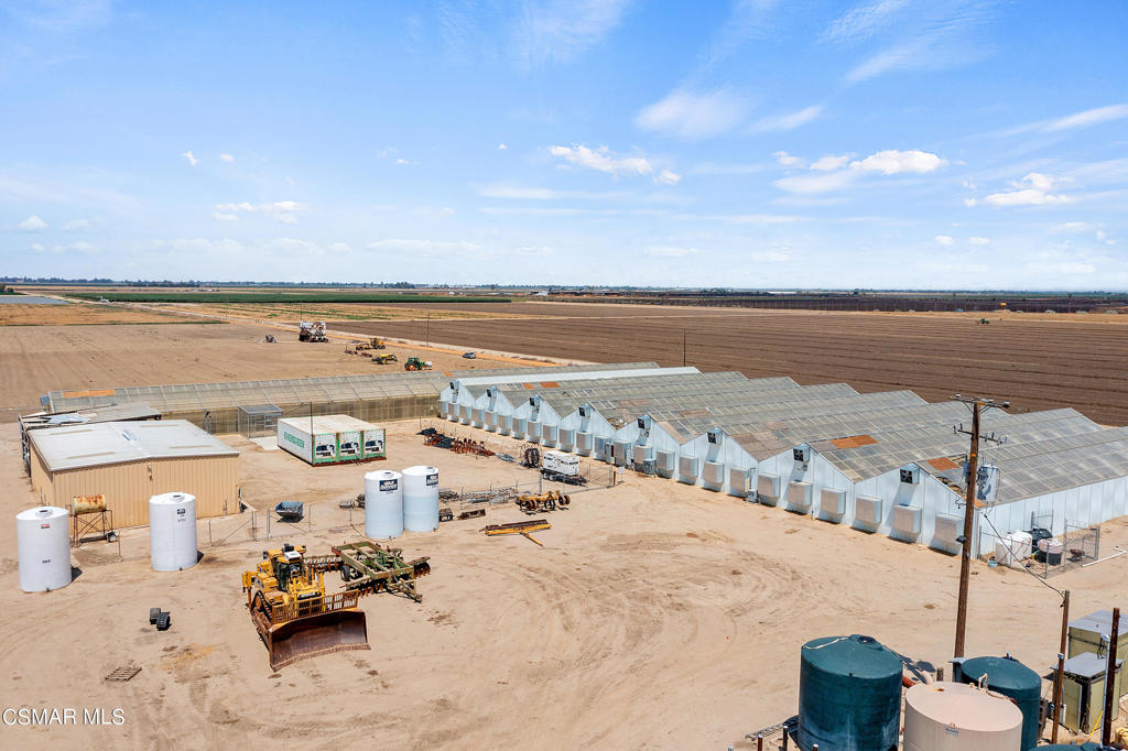 The 640 Ranch (also known as the Pivot-Old Grapes Ranch) consists of 679.72 acres of 5 contiguous parcels. 639.72 acres of open land along with an olive grove spanning 40 acres, dedicated to 2017 Arbequina olives. There are 2 wells, offering 4,301 gallons per minute, or an estimated 19-Acre/Ft of water per day. Complementing this water infrastructure, an essential reservoir with booster and filter station w/VFD further supporting the property's irrigation capabilities. An exceptional feature of this property is a 42,000 sq. ft. greenhouse, spanning nearly an entire acre. Adjacent to this, a well-appointed 3,700 sq. ft. shop for functionality and convenience. Seller will consider all offers.