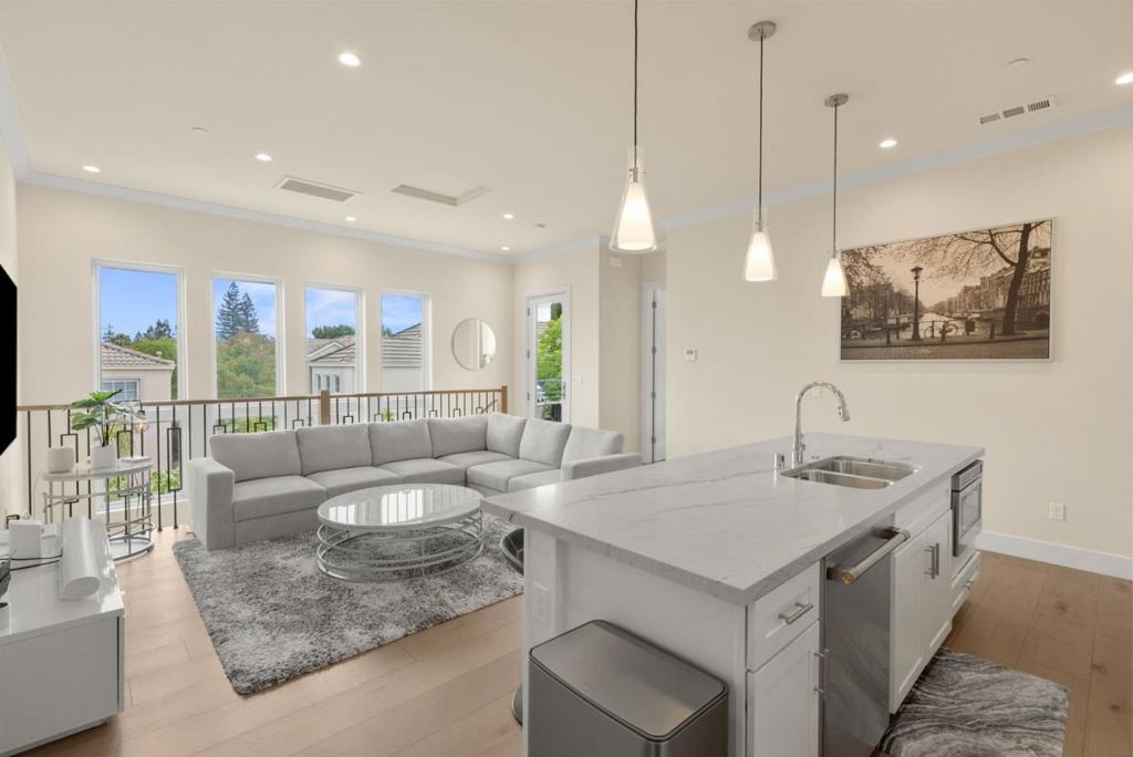 Welcome to 262 Union Ave in LOS GATOS, this modern 2-bedroom, 2-bathroom was built in 2022. Spanning 1,035 sq ft and featuring soaring ceilings, large windows, and an open-concept layout. The kitchen boasts quartz countertops, an oversized island, and premium Monogram stainless steel appliances. The primary suite includes a walk-in closet with custom organizers and a luxurious ensuite bath. The second bedroom offers generous closet space as well as a view of the tree tops. Additional highlights include recessed lighting, central heating and AC, and a private patio with a tree-lined view. Enjoy 2 reserved parking spots, guest parking, and HOA coverage for landscaping, parking, and exterior maintenance. Located near downtown Los Gatos, top schools, and major highways, this is a rare opportunity to own in one of the most sought-after neighborhoods! Don't forget, Cambrian Schools - Alta Vista Elementary, Union Middle, and Leigh High School. This is a perfect opportunity for a high-end, investment grade home in a boutique 3 unit complex. Still has the 10 year Builder's Warranty!