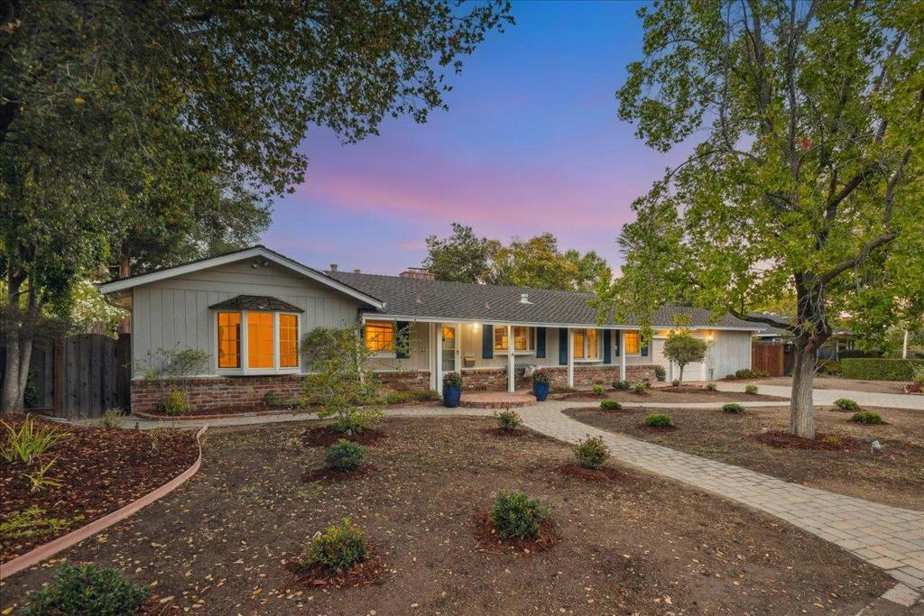 AMAZING AND UNIQUE OPPORTUNITY WITH THE GREATEST MULTI-PURPOSE ROOM YOU HAVE EVER SEEN! Welcome to a spacious single-level home in Saratoga's Golden Triangle on a wide, tree-lined street with classic curb appeal. Walk to Argonaut Shopping Center, Starbucks, Safeway, top-rated Saratoga schools, with downtown, freeways, and transit just minutes away. The home offers approx. 3,797 sqft on a 13,268 sqft lot. Inside, enjoy a bright open layout with a family room, oversized atrium-style space with skylights and soaring ceilings, plus flex areas for offices or play. The kitchen has cherry cabinetry, granite counters, a bay window, breakfast nook, and pantry, with a skylit formal dining area nearby. The primary suite features vaulted ceilings, a fireplace, and opens to a peaceful courtyard. An additional 1-bed, 1-bath section has its own kitchen, vaulted ceilings, laundry, private patio, private driveway, access from the interior and separate access perfect for guests, in-laws, or rental. The backyard offers lawns, brick paths, and a courtyard for dining under the stars. Lots of room to entertain! Additional perks include a presidential shingle roof, two-car garage, large laundry, and ample storage. 20345 Argonaut Drive is ready for todays lifestyle!