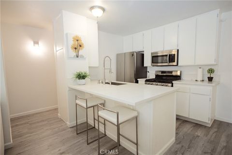 Photo of 15224 Ocaso Ave #H211, La Mirada, CA 90638 (MLS # RS26044334)