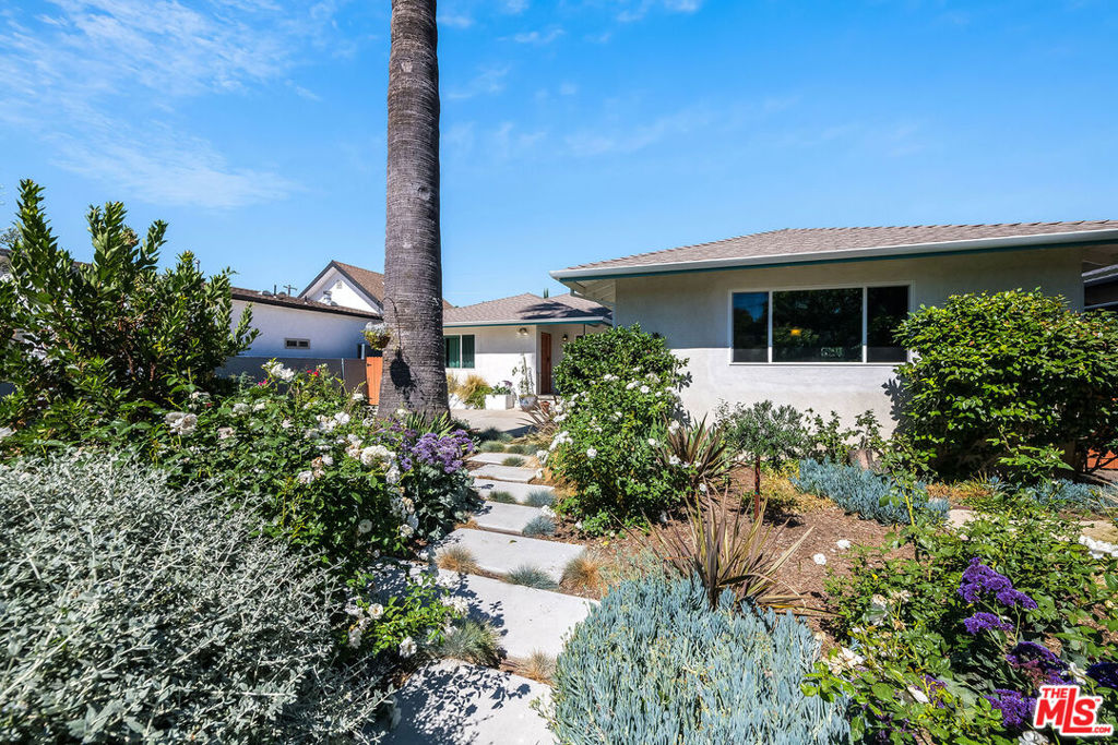 Stylish gated retreat with guest house and private pool, ideal for remote work. Tucked away just minutes from Sherman Oaks, Studio City, and convenient access to both the 405 and 101 freeways, this move-in ready residence offers the perfect blend of comfort, space, and versatility. The primary home boasts three generously sized bedrooms and two bathrooms, along with distinct spaces for dining, lounging, and working. One of the bedrooms is flexible enough to serve as a home office or den, depending on your needs. A sun-filled eat-in kitchen is outfitted with stainless steel appliances including a refrigerator, oven, cooktop, hood, and dishwasher. Adjacent to the kitchen, you'll find a separate laundry room with washer and dryer included. Hardwood floors span the interior, and two charming wood-burning fireplaces create a warm, welcoming atmosphere. The home also includes central heating and air conditioning, an oversized two-car garage, and multiple outdoor areas ideal for dining, lounging, or entertaining. Take a dip or relax by your private pool, perfect for the warmer months. Adding even more value is a detached and recently renovated guest unit, complete with a spacious bedroom or home office, its own full bath, and a convenient kitchenette perfect for guests, extended family, or an inspiring workspace. Main house is approximately 1980 sq ft and the guest house is approximately 260 sq ft per the owner. Pet friendly.