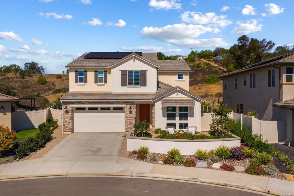 Immaculately maintained and move-in ready, this fully custom 4 bed, 4.5 bath Skylark home sits on an oversized canyon rim and cul-de-sac location. Built and occupied in November 2023, this home offers designer upgrades, owned solar, whole house water filtration system, dark wood cabinetry throughout, gourmet kitchen with quartz counters, full tile backsplash, walk-in pantry, and stainless steel appliances. Added features are the EV-ready charging, leaf-filter gutters, security system with 360° cameras, large bonus room upstairs, upstairs laundry with utility sink and two sliding doors to the California room that is cool all day long from the ocean breezes. This home has been professionally landscaped where the backyard boasts multiple patios, fruit trees, colorful low-water plantings, dual side gates with private canyon views. With no homes in front or behind, open space, next to parks, pond, bocce ball, tot lot, and the dog park, this home is one of a kind.
