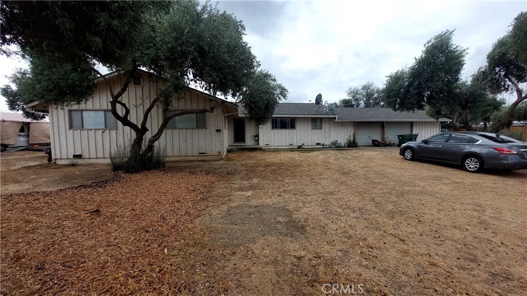 Diamond in the Rough with Huge Potential! 4 Bedrooms, 2 Bathrooms Ranch Style home on 1.19 Acres! Located on the peaceful North edge of Corning, this 1966-built home sits on a spacious 1.19-acre lot and offers an incredible opportunity for investors, flippers, or DIY buyers looking to build equity. Featuring 1,700 sq. ft. of living space, the home includes 4 bedrooms, 2 bathrooms, and a large living room with a cozy fireplace. The floor plan offers a solid foundation for updating and customization. A 2-car attached garage with a dedicated shop area provides extra space for projects or storage. The property is connected to City of Corning water and has an existing septic system. Heating is provided by central natural gas furnace, air conditioning may or may not work and needs tested. The roof, an architectural-style composition shingle, was replaced in May 2015. Out back, you'll find a small olive grove—overgrown but offering excellent potential as a natural privacy screen and windbreak. The home and yard are in need of renovation, making this an ideal candidate for a flip or a homeowner with vision and willingness to invest in improvements. A Cash sale is preferred due to the current condition of the property, which may not qualify for financing. Don’t miss this chance to unlock the potential of this hidden gem. Call today to schedule your private showing!