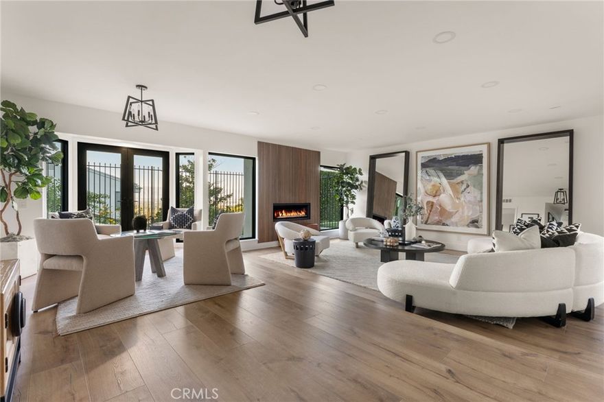 Tucked away in the hills of Encino, this beautifully remodeled single-story 4-bedroom, 3-bathroom home offers breathtaking views, with elegant modern upgrades throughout. Situated on an expansive 14,000+ sq ft lot, this exceptional home blends timeless design, contemporary finishes, and smart-home conveniences into one serene private retreat.



Step through the gated courtyard and new oversized pivot front door into a bright and airy layout featuring formal living and dining rooms, recessed lighting, and French doors with floor-to-ceiling windows that flood the interior with natural light. The large living room includes a gas fireplace, dining area, and seamless backyard access—perfect for entertaining and city-light views. 



The fully remodeled kitchen showcases Café (GE) SMART appliances, a breakfast area with patio access, and stylish finishes designed for both function and beauty. 



The primary suite offers an inviting retreat with French doors opening to the backyard, an ensuite bath with marble floors, double vanity, and a large glass-enclosed shower. All bathrooms have been fully remodeled with modern finishes, complementing the home’s cohesive design.



Outside, enjoy your resort-style backyard featuring a sparkling saltwater pool and spa (with new heater), patio for lounging and al fresco dining, and low-maintenance artificial turf—all oriented to capture unobstructed views of mountains, sunsets, and city lights. A newly designed drainage system efficiently directs water to the street for easy maintenance.



Smart-home enhancements include a Tesla charger, remote-controlled appliances, thermostat, an insulated SMART garage with air conditioning, and CAT5 wiring for faster Wi-Fi. Recent mechanical and structural upgrades ensure lasting quality: new roof, new HVAC with end-to-end ducts, updated electrical and fixtures, new insulated copper plumbing, new insulated floors, and new windows and doors throughout.



For water quality and efficiency, the property features a whole-home water filtration system, reverse osmosis (RO) filtration, and a chilled RO drinking water system that also feeds the refrigerator ice maker.



Conveniently located near Lanai Road Elementary School, hiking trails, and popular shops and restaurants, this home truly embodies the best of Encino hillside living—where luxury, technology, and natural beauty come together.