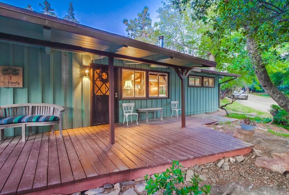Charming home on a quiet street in the heart of Julian. This private, tucked away retreat offers a chance to enjoy all that life in the mountains has to offer. The home rests on just under 1/4 of an acre, and boasts 2 spacious bedrooms, a large living area that opens to the kitchen, and a dining space overlooking the beautiful outdoors. The custom windows throughout bring in tons of natural light and the vaulted ceilings create a sense of openness, while preserving the cozy-cabin feel. The home is perfect for a small family, or could be used as a vacation home getaway and the detached 2-car garage offers space for storage and parking. Pride of ownership abounds with updated flooring, fresh exterior paint, and dual pane windows. The front patio is the perfect spot to enjoy a morning cup of coffee or an evening outside watching the sunset. Hurry, this one won't last long! Kentwood in the Pines is only 5 minutes from downtown Julian, which is known for its historic charm, apple orchards, and stunning mountain scenery. Julian offers a peaceful retreat just an hour from the hustle and bustle of San Diego.