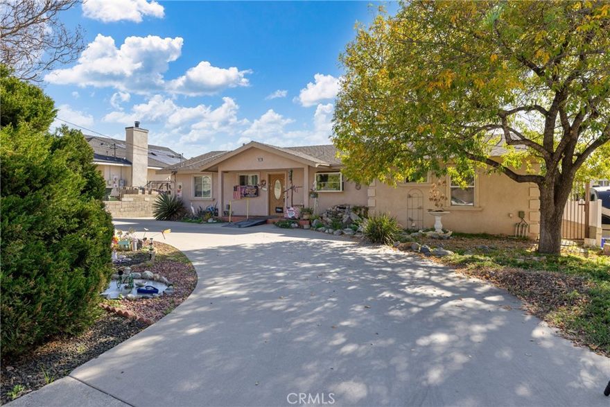 Welcome to this well located 3 bedroom, 2 bath home offering a comfortable and versatile living experience in the foothills of San Bernardino. Situated on a cul de sac with mountain and sunset views, this home is just minutes from nearby parks and scenic hiking trails.

Inside, the functional floor plan includes an entry, living room, dining area, kitchen, laundry room, and a spacious step down den, ideal for entertaining, a media room, or flexible living space. The kitchen features granite tile countertops, generous cabinetry including a large corner lazy Susan, and flows seamlessly into the main living areas. Cherry wood flooring adds warmth and character throughout.

The primary suite offers a spa-like bathroom with dual sinks, a walk-in shower, a two person jacuzzi tub, and a private toilet area. The thoughtfully designed primary closet provides ample space for long garments and built in organization.

Outdoor living is equally inviting with a covered entryway, covered back patio, and a gated backyard perfect for relaxing or entertaining. The front yard features mostly water saving landscaping, while the backyard includes garden space and a mature fruit orchard. A circular driveway allows for easy parking, and the detached two car garage offers workshop potential and is ready for EV charging upgrades.

Additional highlights include paid off solar at closing, providing long term energy savings. Financing options include Conventional, FHA, and VA loans with pre qualification required.

A home offering space, views, and flexibility, ready for its next chapter.