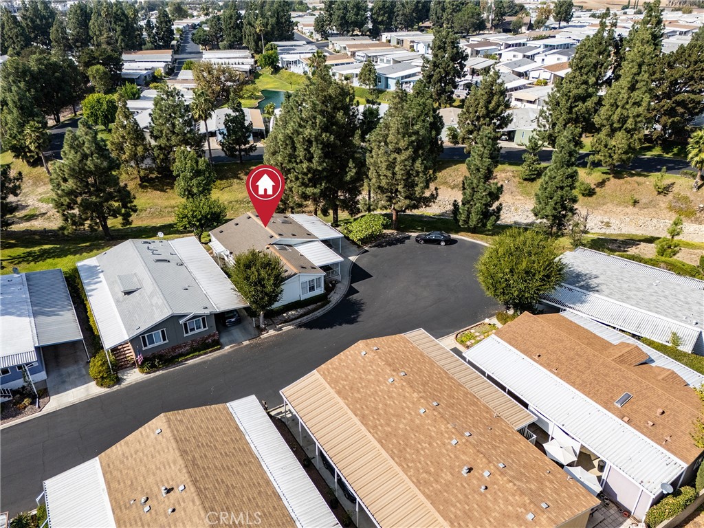Welcome to your new home in the peaceful and serene Forest Gardens Mobile Home Community, a highly sought-after 55+ senior living community in beautiful Lake Forest! This spacious 2-bedroom, 2-bathroom home offers a third room, perfect for use as an office or additional bedroom, complete with elegant French doors. The master bedroom features stunning shutter windows and a large walk-in closet, while the entire home boasts gorgeous laminate floors, fresh interior paint and deep cleaned bedroom carpets.
The kitchen offers plenty of storage and cabinetry, making it perfect for all your culinary needs. A dedicated laundry room adds convenience to your daily routine. Situated at the end of a quiet cul-de-sac, this home provides privacy and tranquility, ideal for enjoying the peaceful surroundings.
Forest Gardens offers beautifully landscaped grounds, recreational facilities, and a variety of activities such as social gatherings, exercise classes, and outdoor activities. This is more than just a home—it's a lifestyle! Don't miss the opportunity to join this vibrant community.