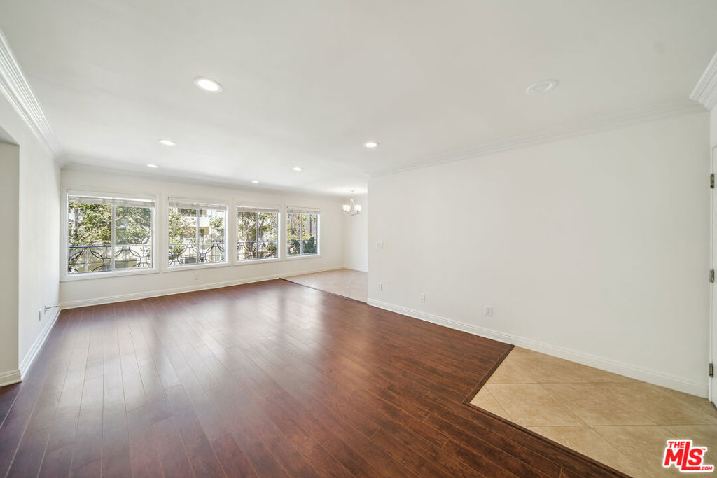 Beverly Hills Controlled Access Remodeled Unit Upper/front unit Central A/C New Appliances Granite Kitchen Pergowood floors Closets Pool laundry facilities on site. 1 parking spot. Welcome to your upper-floor oasis in prime Beverly Hills! This bright and spacious 2-bedroom, 2-bathroom unit offers stunning views of the Hollywood Hills and an abundance of natural light streaming through large windows, beautifully complemented by updated flooring and recessed lighting throughout. Step into the stylish kitchen featuring modern wood cabinetry and sleek quartz countertops. Please note: the tenant will need to provide their own refrigerator. Both bedrooms offer en suite bathrooms and sweeping hillside views, providing the perfect blend of comfort and privacy. You'll also enjoy plenty of storage space throughout the unit. Located in a secure, gated building with gated parking, this well-maintained property includes on-site laundry facilities, professional on-site management, and a refreshing pool ideal for relaxing and entertaining. Don't miss this rare opportunity to live in one of L.A.'s most sought-after neighborhoods!