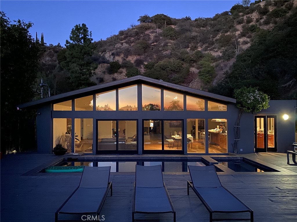 Short-term rental with hotel-like amenities! Home is fully furnished. Extremely private single story home surrounded by nature. Beautiful mid-century style modern home originally designed by Neutra apprentice Donald P. Polsky. Panoramic view of ocean and canyon view. Large backyard with swimming pool and spa. Bright open floor plan with high ceiling through-out the home. 3 large bedroom suite each with it’s own private bathroom lots of closet space. Additional office room and guest bathroom. Gourmet kitchen with huge island, built-in Sub Zero fridge, upgraded appliances, and mini-wine fridge. 2 car garage with Telsa EV Charger. Separate room on side of home can be used as storage or more office space. Landlord pays for water, electricity, gas, trash, gardener, pool man. Available for immediate move-in.