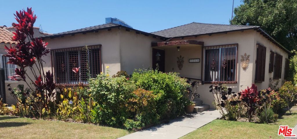 Walkable West Adams neighborhood! Just blocks from the Expo Line Station, Cumulus Development, Whole Foods Market, Culver City art district and Trendy West Adams Blvd. This home has good bones begging for a modern artist renovation and possiable ADU. 3 Bedrooms with 2 baths, living room w/fireplace has open concept to kitchen & dining area with built-in shelving. A long driveway leads to a 2 Car detached garage with attached enclosed patio and private yard.