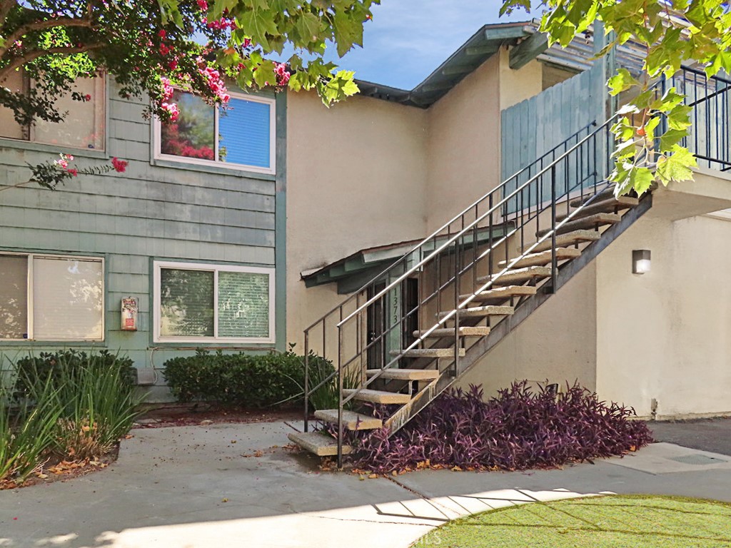 Welcome to Wheaton Way! In the beautiful gated community of University Greens you have this cozy two story condo with open floor plan. Living room with wood like tile and ceiling fans. Dining area with the lovely kitchen right next to it you will find the laundry space that includes a stacked washer and dryer. Upstairs you will find the two spacious bedrooms with laminate flooring and hallway bathroom. Enclosed private backyard with sliding door access. Single car garage with remote control and one onsite parking permit, so total of two parking spots! The gated community has nice landscaping, pool, spa and club house. Conveniently located near UCR, freeways, shopping and dining. This home will not last, make it yours today!!!
