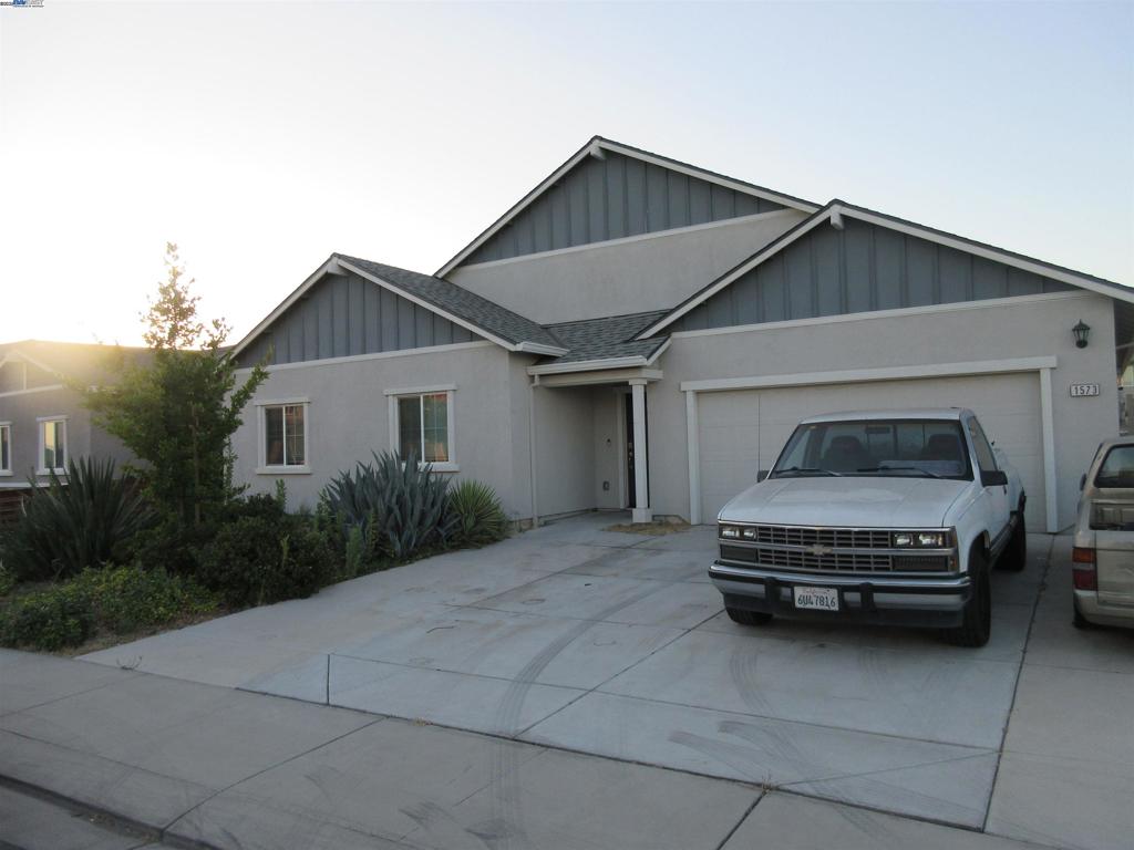 Beautiful 3 bedroom 2 bath spacious single level home. Tile throughout common areas & carpet in the bedrooms. This home is located steps from a beautiful park that's perfectly manicured. Kitchen has stone counter tops with painted cabinets. Master bedroom & bath located in an area of its own away from other bedrooms. Two bedrooms and full bathroom located on the other side of the home with its own hallway. Two car garage with finished & textured walls with high quality epoxy flooring. The backyard is huge roughly 80ft by 60ft open area unfinished like a blank canvas. It possibly can be designed for a ADU & a swimming pool with assistance from a professional. The driveway has had extra concrete poured and can hold up to 3 vehicles. Landscaping looks vibrant with a host of succulents. Located near several HWY's to access the bay area or surrounding central valley cities. This home is priced aggressively for a quick sell!