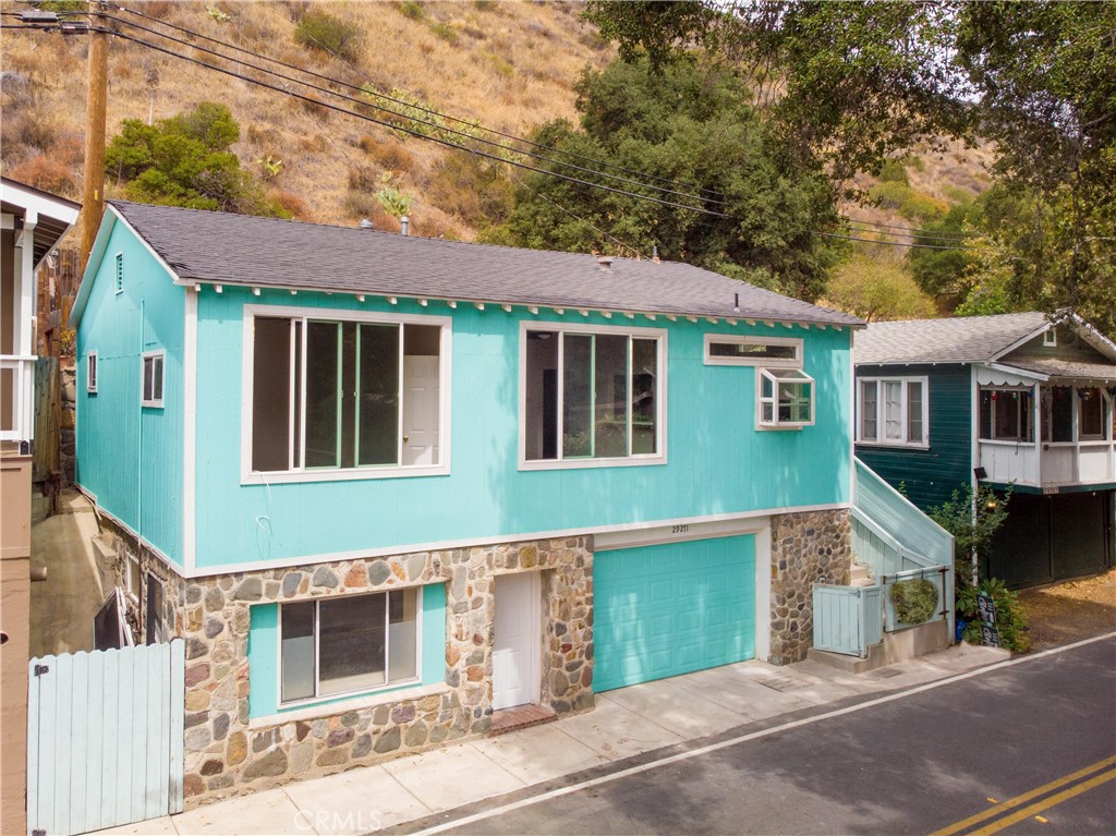 Charming 3-bedroom, 1-bath home nestled in the tranquil hills of Silverado Canyon. Built in 1947, this approx. 1,380 sq ft residence blends vintage character with serene canyon living. The home features two main-level bedrooms and an additional private bedroom on the lower level—ideal as a guest room, office, or creative studio. The interior of the home has been tastefully remodeled throughout. Bright and open interiors with large windows capture natural light and refreshing canyon breezes throughout. Terraced backyard offers space for dining, entertaining, or enjoying peaceful canyon views. The two car garage is an awesome feature in an area where parking comes at a premium. Located on the desirable north side of Silverado Canyon, just minutes to local amenities including post office, hiking trails, community center, and the Silverado Café. Enjoy the charm of small-town living with seasonal events, farmers markets, and easy access to Irvine, Lake Forest, and Orange—only ~15 minutes away. Ideal for buyers seeking privacy, character, and a true escape from the city while remaining conveniently connected. No HOA. A rare opportunity to own in one of Orange County’s most scenic and historic communities.